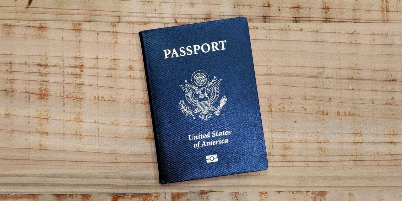 passport sitting on a wooden table
